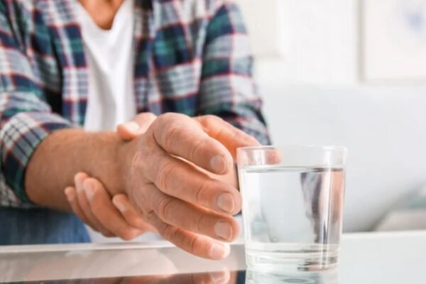 Hands picking up a glass